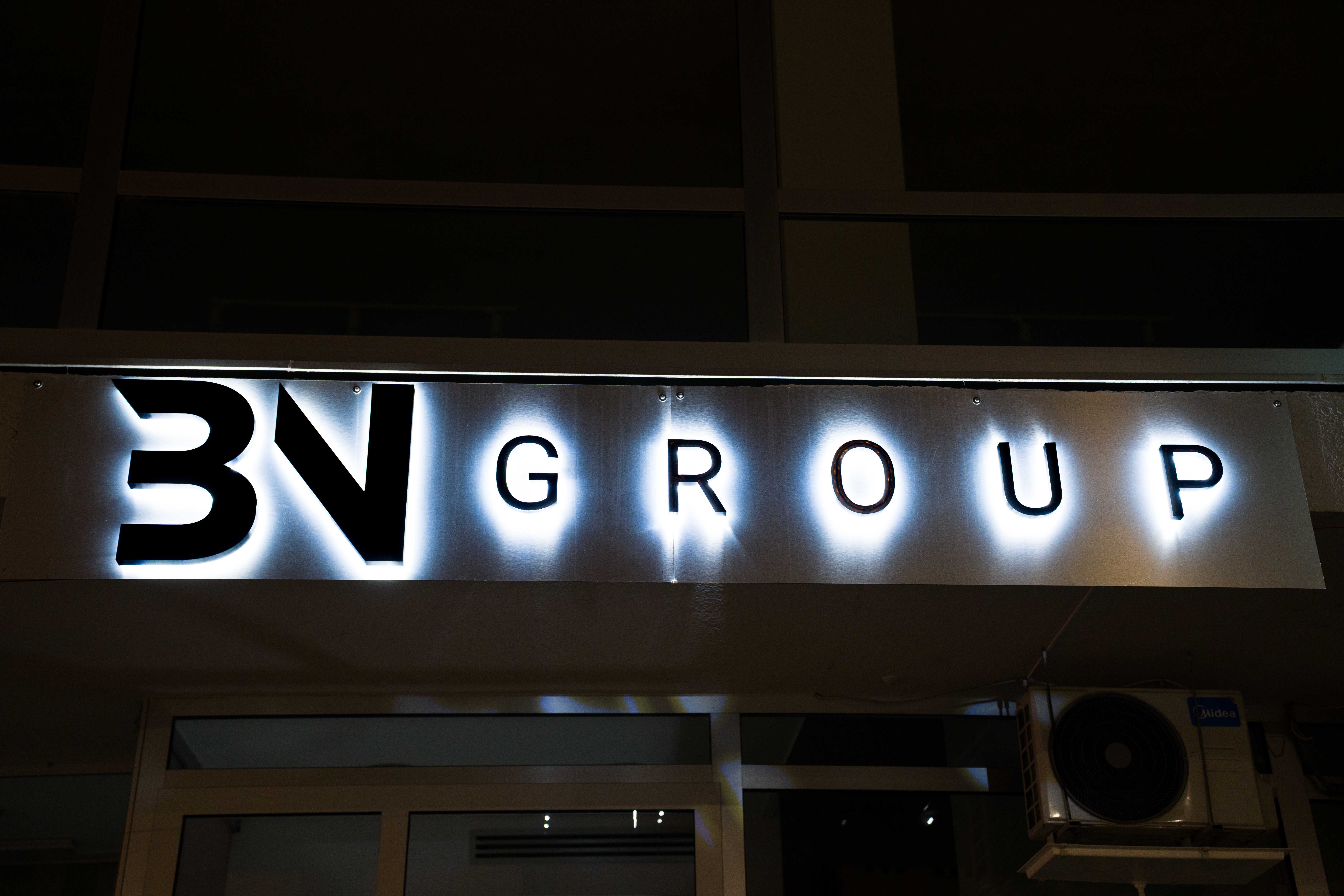 3V Group exterior side-lit signage at night